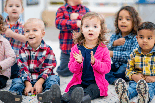 Children singing and clapping for Bible Songs.