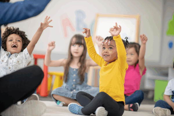 Children singing and doing motions to Bible songs.