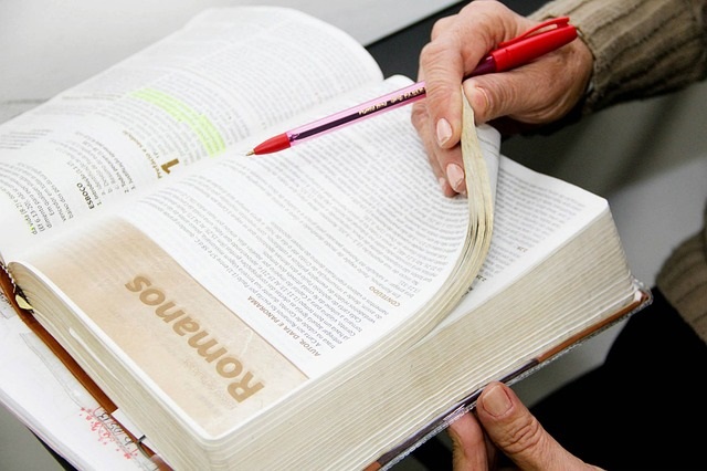 Woman looking in her Bible for a Quiet Time.