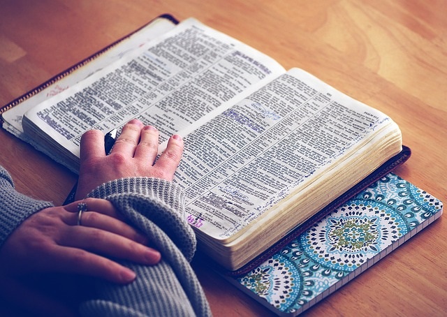 Woman sitting with Bible for  a quiet time.