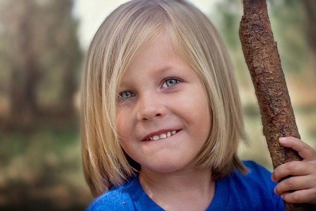 Child standing outside.