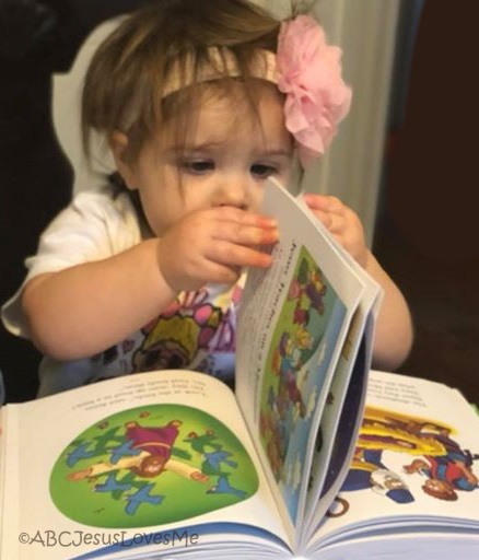 Child reading a Bible.