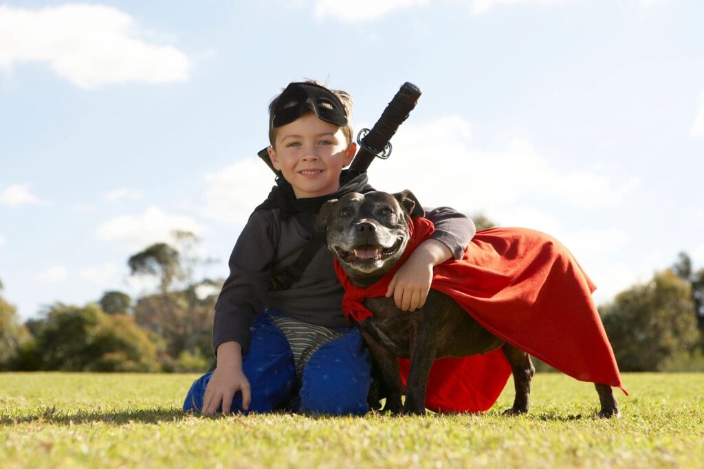 child playing with dog.