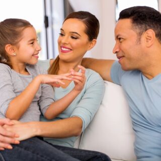 mom, dad, daughter talking