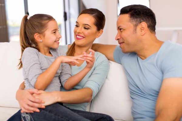 mom, dad, daughter talking