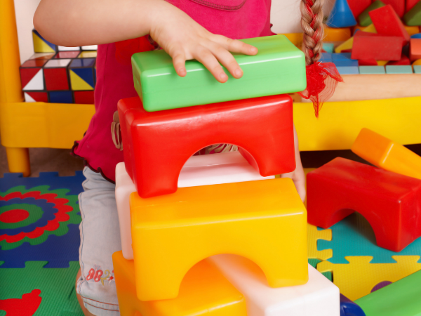 Child playing with blocks to increase Visual Perception skills.