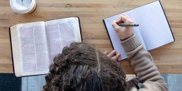 Woman with her Bible and a journal.