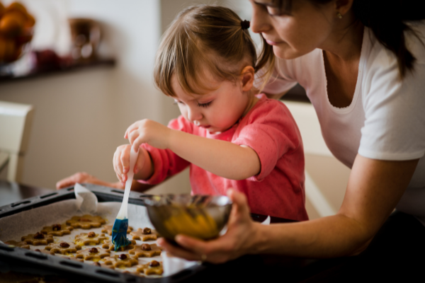 Mom and child baking.