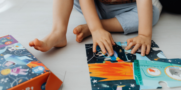 Child playing in bedroom during quiet time.