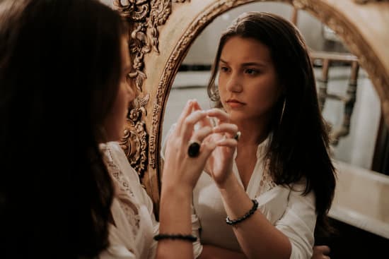 A woman looking in the mirror.