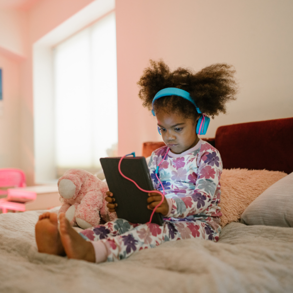 Child with electronic.