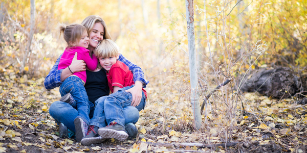 Mom outside with two young children