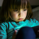 Child on an electronic device.