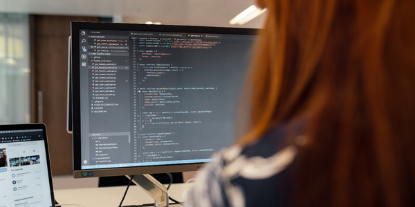 Woman coding on a computer.