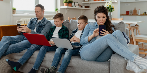 Family on technological devices.