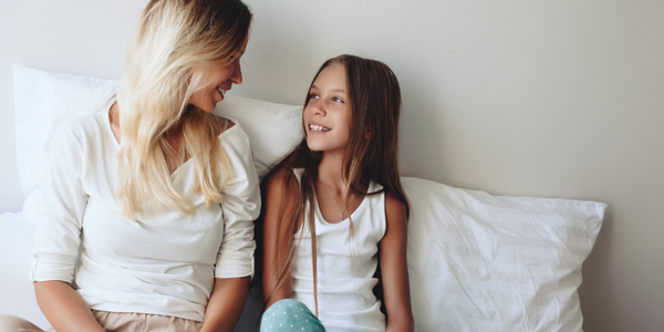 Mother and daughter talking about technology.