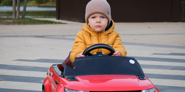 Child in battery-powered car.