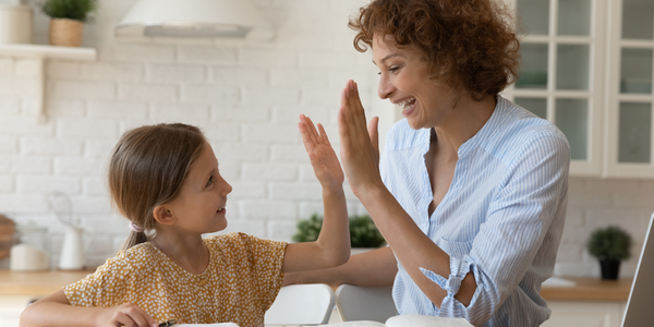 Parent giving child praise.