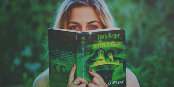 Woman looking over a Harry Potter book.