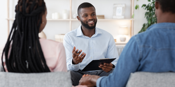 Married couple receiving financial therapy.