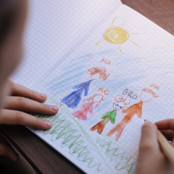 Child drawing his people, his family.