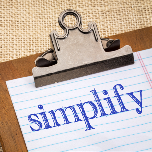 Simplify written on a piece of paper.