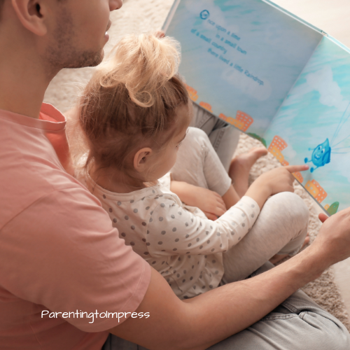 A dad and daughter reading a book.