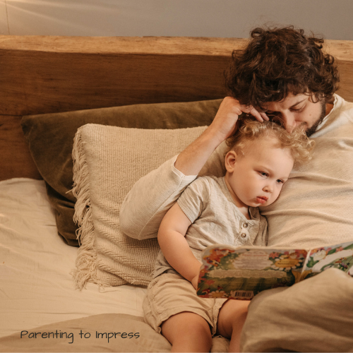 Daddy reading to son at bedtime.
