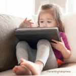 A little girl on an ipad