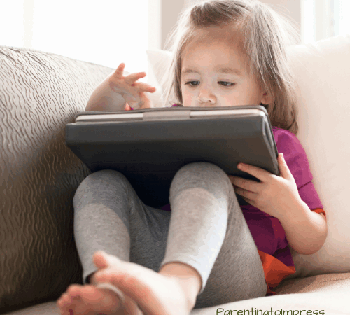 A little girl on an ipad