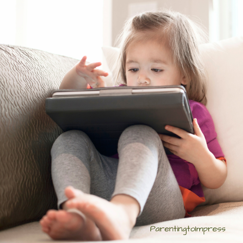 A little girl on an ipad