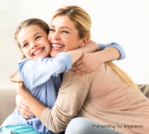 Mom and daughter huggin.