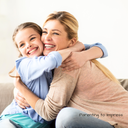 Mom and daughter huggin.