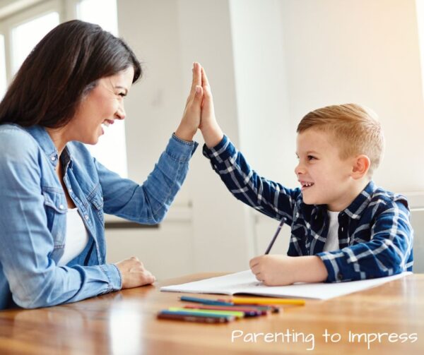 a mom giving her son a high five