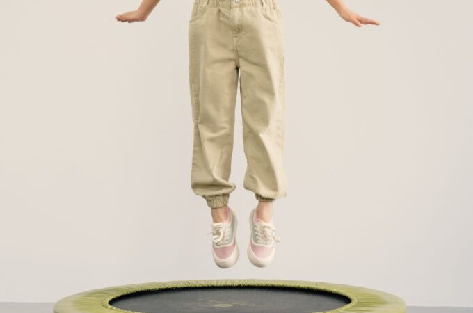 child jumping on mini trampoline