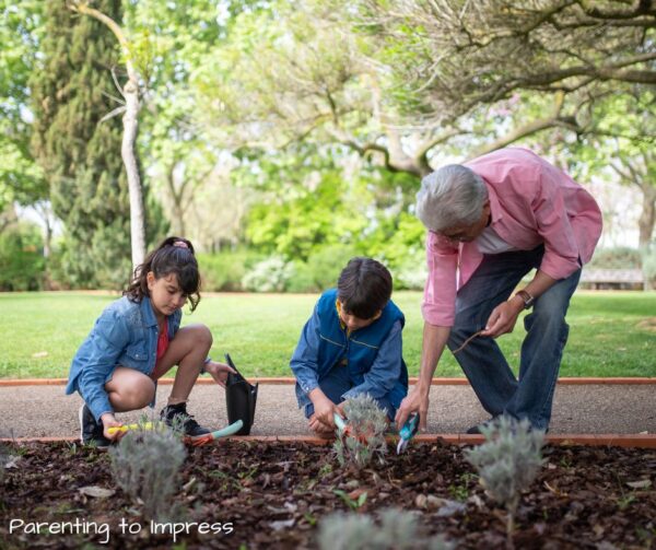 2 children, gardening with a grandparent or mentor