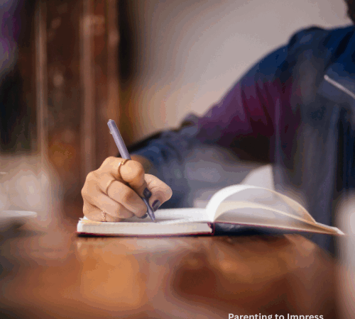 A woman writing in her journal.