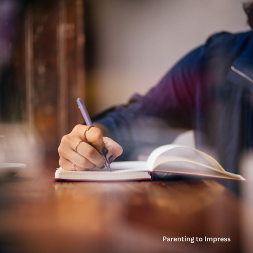 A woman writing in her journal.