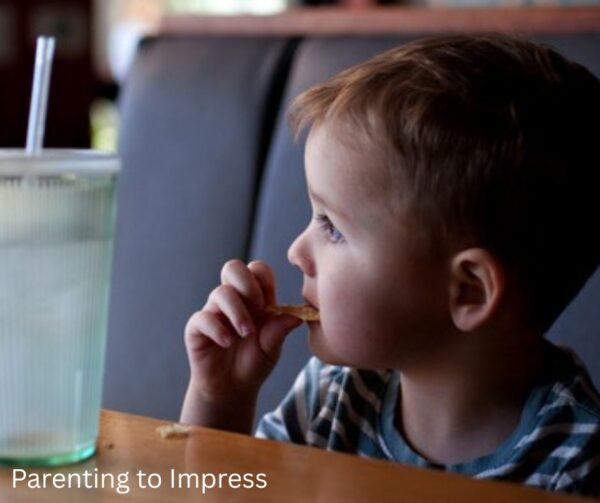 a child sitting in a restaurant booth