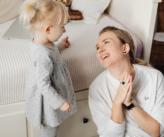 A mom talking to her toddler.