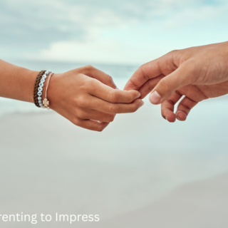 a parents hand letting go of a child's hand