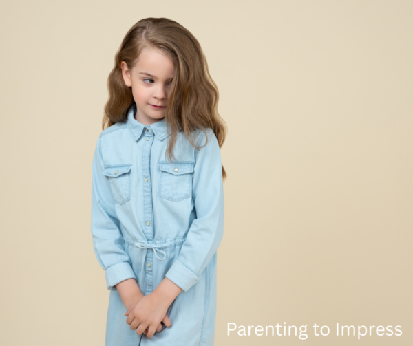 A shy little girl, who is looking down and off to the side, still growing her courage