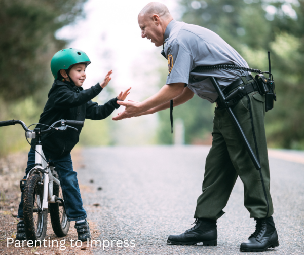 Child courageously giving high five to a police officer, knowing this is a safe stranger