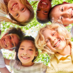 a circle of smiling confident kids